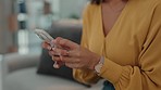 Typing, sofa and hands of woman with phone for text message, chat and online conversation in living room. Networking, communication and girl on smartphone for social media post, website and internet