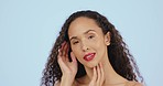 Face, beauty and red lipstick, makeup and black woman with cosmetic product on blue background. Female smile in portrait, satisfied with cosmetics for lips, cosmetology and skincare glow in studio