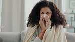 Sick, blowing nose and woman in a home living room with illness and tissue for virus and covid. Sofa, lounge and sinus problem of a mixed race female with allergies, flu and sneezing issue in a house