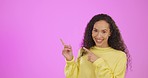 Advertising, happy and portrait of a woman pointing isolated on a pink background in a studio. Showing, mockup and girl marketing, doing an advertisement or presentation on a space for recommendation