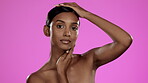 Beauty, skincare and face of Indian woman in studio posing with hands, cosmetics and isolated on pink background. Natural makeup, dermatology and skin care model with luxury spa or salon detox facial