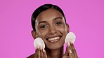 Beauty, skincare and Indian woman with cotton pads in studio, cleansing cosmetics isolated on pink background. Natural makeup, dermatology and skin care model with spa or salon detox facial cleaning.