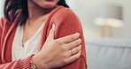 Feeling, injury and hand of a woman with arm pain from an accident, muscle strain or weakness. Touching, sensitive and person with a hurt, swollen and painful shoulder with an inflammation problem