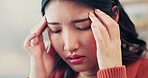 Pain, stress and woman with headache, mental health and dizzy feeling in living room, depression and problems. Female lady and migraine in lounge, tension and muscle strain with anxiety and burnout