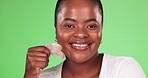 Face, cotton pad and black woman with makeup, beauty and grooming against a studio background. Portrait female and lady with cosmetics green screen and routine for foundation removal and smooth skin