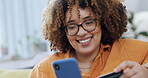 Black woman on cellphone and credit card, smile for online shopping, ecommerce and fintech easy payment at home. Young person typing bank information on her phone for finance transaction on her sofa