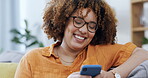 Black woman laughing on a phone and sofa for funny internet meme, social media post or texting on mobile app. Young happy person on couch or living room typing on a cellphone, smartphone or web chat