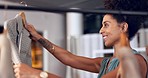 Fashion choice, happy woman and retail store shopping of a mixed race female looking at sale item. Happiness, smile and customer in a boutique and mall shop making a discount clothes decision