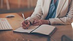 Planning, notebook and businesswoman writing notes in the office while doing research for a report. Information, brainstorming and closeup of a female employee working on a project in the workplace.