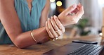 Business woman doing a wrist exercise in the office for pain, injury or medical emergency. Health, carpal tunnel and closeup of a professional female employee with sprain muscle in hand at workplace.