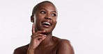 Thinking, happy and hand on face of black woman in studio for body care, wellness or cosmetics on white background. Portrait, smile and girl beauty model relax with skincare, treatment or results