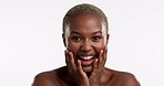 Laughing, skincare and excited face of a black woman isolated on a white background in a studio. Happy, smile and a portrait of an African model touching skin for a glow, beauty and happiness