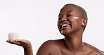 Skincare, hands and happy black woman with face cream in studio, cosmetics or treatment on white background. Facial, sunscreen or moisturizer for girl model with collagen, lotion or product isolated