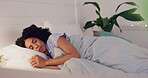 Woman, bed and insomnia or restless for sleep or rest in home bedroom with fatigue or stress. Female person frustrated with sleeping problem, depression or disorder while dreaming or sleepless