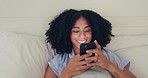 Phone, happy woman and bed of a young female texting on a social media app in the morning. Wifi, web networking and happiness of a young person with a smile in a house writing a text in a chat