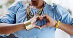 Black woman, hands and heart sign for business, love or support in compassion or care at the office. Hand of African American female employee showing hearty emoji, symbol or gesture at the workplace