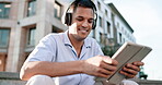 Music, tablet and happy with man in city for streaming service, happiness and social media. Online radio, dance and digital with male listening to headphones for audio, songs and entertainment