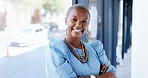 Face, business and smile of black woman with arms crossed in office with pride for career or job. Portrait, professional and happy, confident or proud laughing female entrepreneur from South Africa.