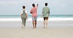 Walking, back and friends at the beach for holiday, travel and relaxation by the sea in Bali. Summer, together and group of people looking at the view by the ocean, enjoying nature and talking