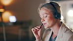 Talking, advice and woman with a headset in a call center for communication, help and consulting. Contact us, telemarketing and customer service agent speaking into a microphone at night for support