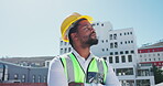 Proud engineering black man with outdoor planning, thinking of construction worker job and project management. Happy contractor, electrician or builder with city architecture or buildings on blue sky