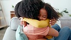 Love, mother and girl hug, quality time or happiness in living room, care or cheerful together. Family, mama and daughter embrace, joyful or bonding in lounge, affection or child development on sofa 