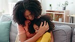 Sad, comfort and mother with child on sofa for compassion, emotional support and caring at home. Love, family and mom comforting, hugging and console young girl upset, depressed and unhappy on couch