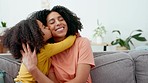 Love, kiss and hugh by mother and daughter on a sofa, happy and bonding in their home together. Family, embrace and girl kissing parent on couch, sweet and smile while enjoying weekend in living room