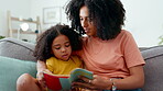 Mother, child and reading book on sofa in home with love, care and support of black family. Woman and girl together for bonding, story and learning in house living room with books for education