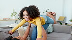 Mother, child and lifting in air on sofa in home with love, care and support of black family. Woman and girl together for bonding, play and fun in house living room while happy with energy and smile