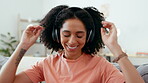 Music headphones, dance and woman on sofa in home living room having fun. Technology, freedom or happy female streaming, listening or enjoying audio, podcast or radio on couch in lounge while dancing