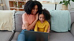 Learning, mother and girl typing on laptop on sofa in home living room, care and bonding. Computer, family education and happy mama teaching kid or child how to type for elearning and homeschool.