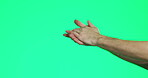 Hands, applause and support with celebration and achievement, success and victory on green background. Person clapping, mockup space and gesture with emoji, celebrate and cheers in studio for winner