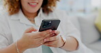 Woman, phone and typing in social media, communication or chatting on living room sofa at home. Hand of happy female texting on mobile smartphone app for browsing, email or searching on lounge couch