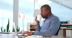 Business, black man and drinking coffee on laptop, typing online report and planning project at night. Serious male employee with cup of tea at computer, technology and review research data in office