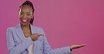 Portrait, marketing and a business black woman pointing to blank mockup space for product placement. Advertising, branding and promotion with a female employee in studio on a mock up pink background