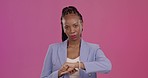 Watch, late and face of a black woman in a studio checking the time with disappointment. Mad, annoyed and portrait of an African female model with a schedule or deadline isolated by purple background