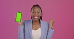 Black woman, phone and green screen on mockup winning, sale or discount against a studio background. Happy African American female winner in celebration showing smartphone with chromakey display