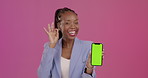 Black woman, phone and green screen on mockup for marketing or advertising against a studio background. Happy African American female showing okay hand sign holding smartphone with chromakey display