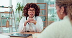 Woman doctor talking to patient in office for infertility treatment, healthcare advice and consulting services. Biracial medical professional giving happy feedback or speaking in consultation support