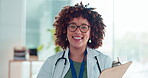 Doctor face, clipboard and smile of woman in hospital with pride for career or job in clinic. Healthcare, portrait and happy mixed race female medical professional from South Africa holding checklist