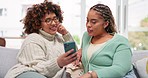 Phone, women and couple of friends on a sofa, happy and smile while browsing the internet in a living room. Lesbian, influencer and smartphone for social media, blog or podcast post, search or vlog
