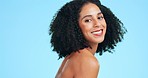 Smile, skincare and face of black woman for beauty, wellness and facial treatment on blue background. Dermatology, spa aesthetic and happy confident girl in studio for cosmetics, makeup and hair care