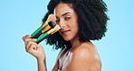 Beauty, makeup brush and face of woman in studio for cosmetics, dermatology and skincare. Aesthetic female model facial tools for foundation portrait with self care glow product on blue background