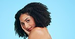 Beauty, skincare and face of black woman for wellness, spa aesthetic and facial on blue background. Dermatology, confident and portrait of happy girl in studio for cosmetics, makeup and hair care