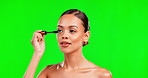 Beauty, eyelash and mascara on woman with green screen background for makeup, cosmetic and glow. Aesthetic female model with smile for brush on eyes for skincare and cosmetology mockup in studio