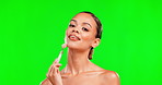 Beauty, facial roller and woman portrait on green screen background for skincare, cosmetic and glow. Aesthetic female model with smile for face massage product for smooth skin mockup in studio
