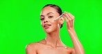 Green screen, skincare and oil for face of woman in studio with serum, liquid and product, vitamin c and hydration. Beauty, portrait and glowing girl model relax with retinol, hyaluronic acid routine