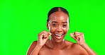 Portrait, dental floss and woman in studio for teeth, cleaning and hygiene against green screen background. Oral, face and happy girl flossing for fresh, clean and breath, routine and prevention