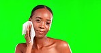 Face, skincare and black woman with wipe, dermatology and beauty on studio background. Portrait, African American female and lady with cosmetics towel, remove makeup and foundation with green screen